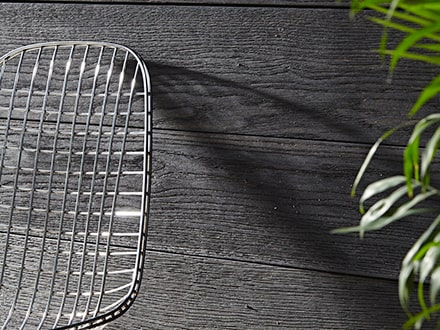 Burnt cedar decking used for cladding